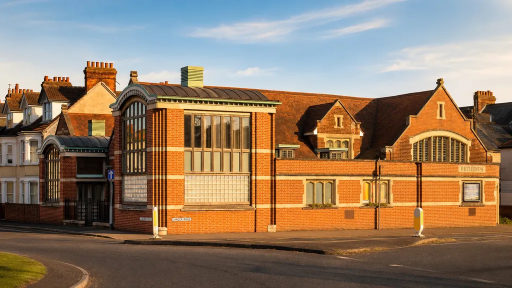 The full frontage of Bethesda Baptist Church along Cavendish Road, lit by evening sun